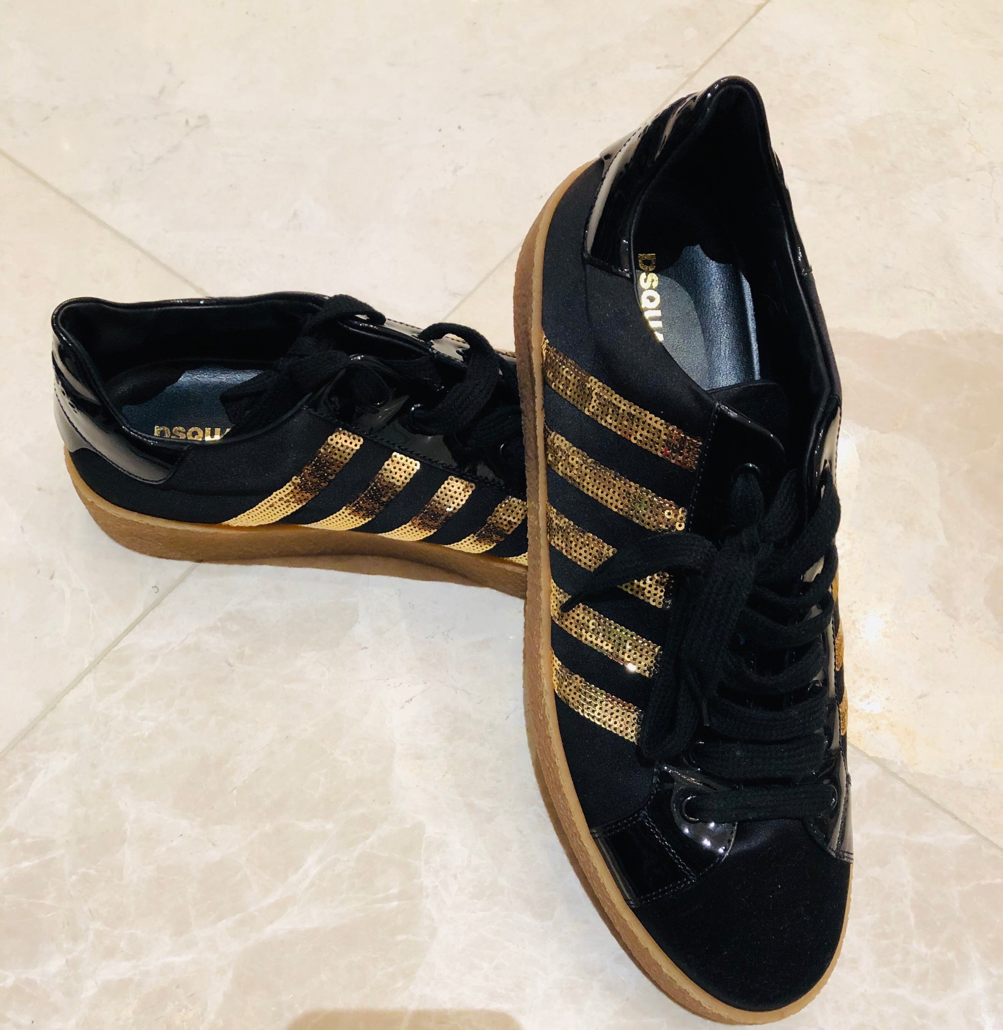 Black gold top tennis shoes